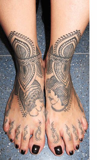 Tattooed feet of Sunshine Flores.